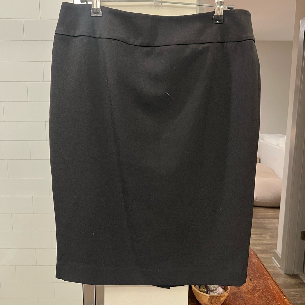 Black knee-length skirt